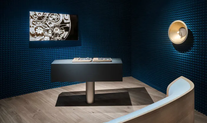 Watch display in a dark blue acoustic room at the Audemars Piguet exhibit
