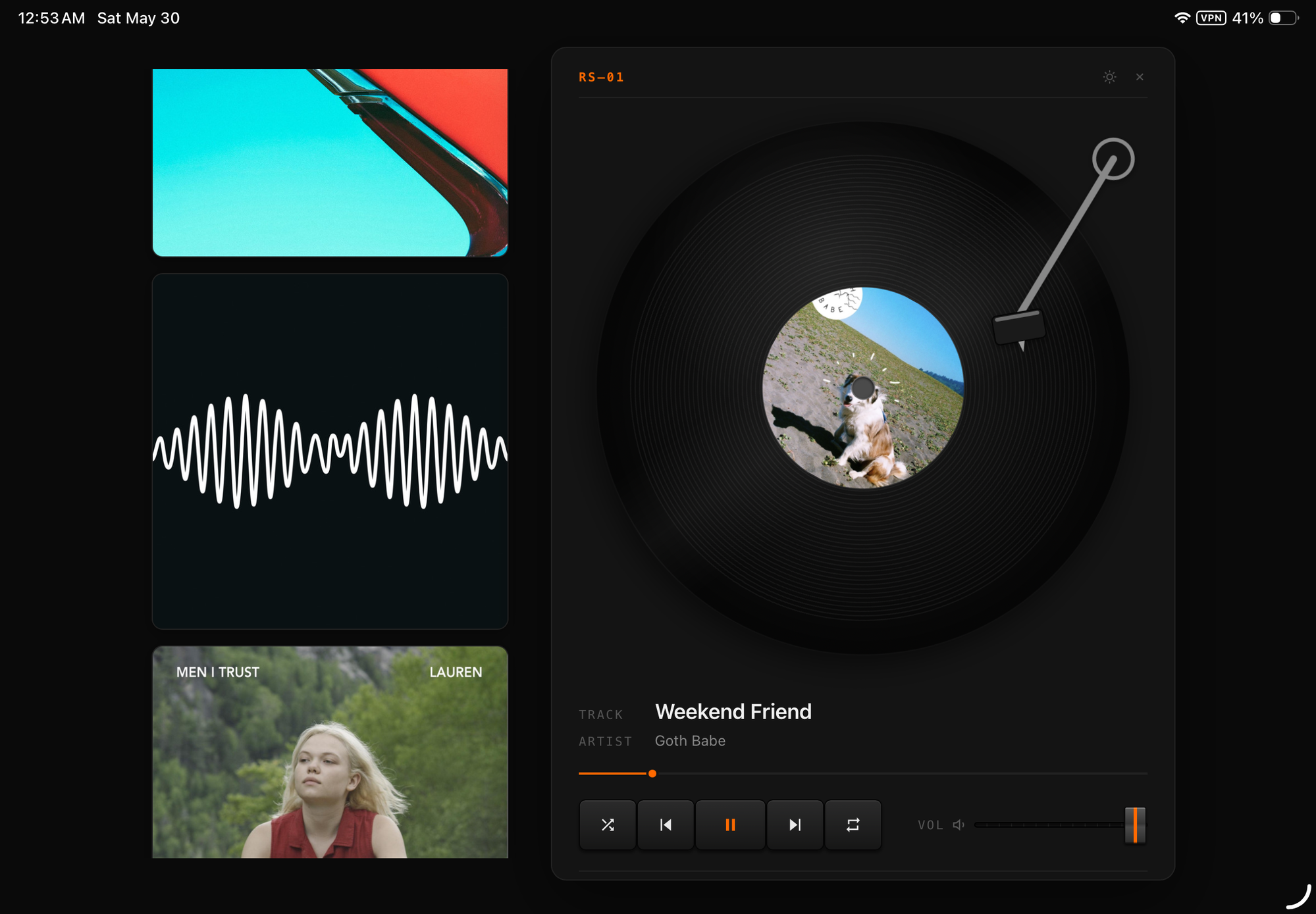 Vinyl Deck in dark mode: a Spotify track shown as a spinning vinyl record with album art on the label, a tonearm, and playback controls